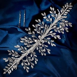 Detail of luxury bridal headband with silver rhinestone leaves on blue satin fabric