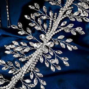 Detail view of handmade luxury bridal hairband with crystal rhinestones on blue satin