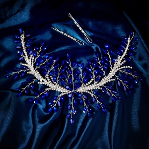 Detailed macro of silver bridal hair vine with luxury royal blue crystals and rhinestones