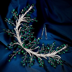 Detailed macro view of emerald crystal bridal headband with marquise rhinestones