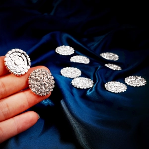 Macro view of luxury sparkling rhinestone flower buckle with silver plated metal base
