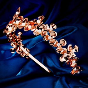 Elegant French vintage gold flower headband with intricate metal petals and pearls for brides