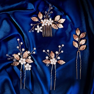 Vintage rose gold bridal hairpiece set with handmade woven leaves and pearls on navy silk