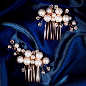 Handmade bridal hair comb set with pearls and rhinestones on elegant blue silk fabric