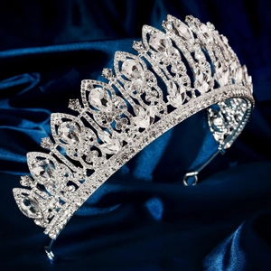 Elegant silver tiara with sparkling crystal rhinestones for weddings on blue satin base