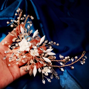 Exquisite handmade bridal headband with white flowers and pearls on golden wire