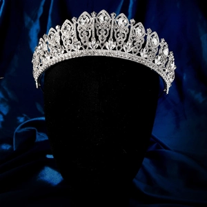 Detail of luxury bridal tiara with sparkling crystals on a black mannequin display