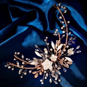 Detailed close-up of handmade bridal headband with resin flowers and pearls