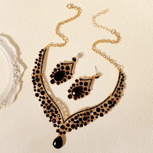 Detailed macro view of vintage luxury black crystal necklace and matching drop earrings set