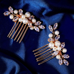 Elegant pair of gold bridal hair combs with white pearls and sparkling marquise rhinestones