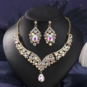 Detailed view of luxury bridal jewelry set with colorful rhinestones on black bust