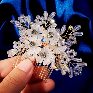 Exquisite bridal flower hair comb with white crystal petals and golden wire craft