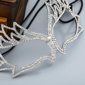 Detailed macro view of high-end silver wing mask with sparkling crystals for gala