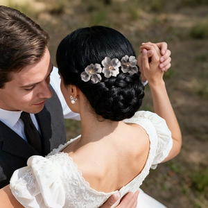 Elegant floral U-shaped hairpins with pearls for bridal hair styling in outdoor wedding