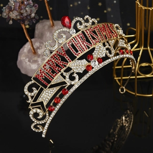 Golden Merry Christmas crown with red and white rhinestones on black reflective background