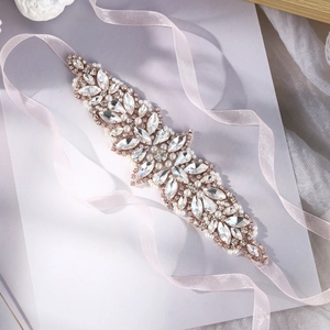 Elegant bridal waist belt with sparkling rhinestones and pearls on soft pink ribbon
