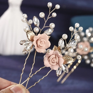 Handmade flower hair pins set with pink roses and pearls for elegant bridal hairstyling