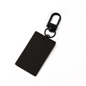 Matte black rectangular metal keychain tag with lobster clasp on a clean white background