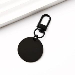 Detail shot of black polished stainless steel round keychain with lobster clasp and ring