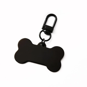 Polished black bone-shaped metal pet ID tag with matching lobster clasp connector