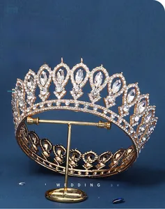 Detailed close-up of a vintage bridal crown with sparkling crystals on a golden frame