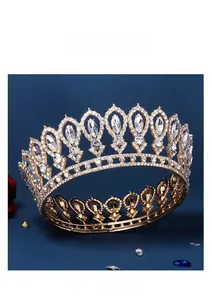 Detailed close-up of a luxury vintage gold bridal tiara with sparkling crystal rhinestones