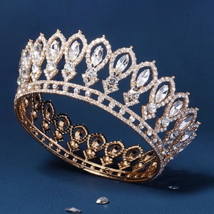 Luxurious gold crystal bridal crown with sparkling rhinestones in a vintage round design