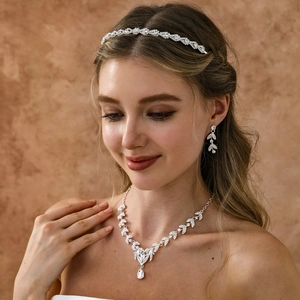 Sparkling silver bridal jewelry set with crystal leaf headband, necklace and earrings