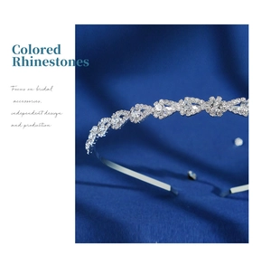 Detail shot of a silver crystal headband featuring intricate water drop rhinestone patterns