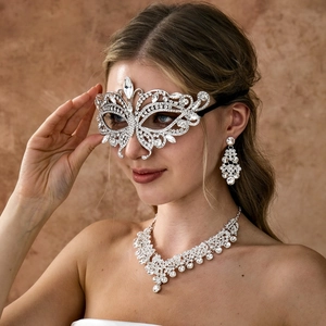 Detailed close-up of luxury rhinestone mask, fringe necklace, and tassel earrings set