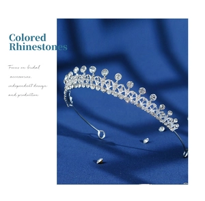 Close-up of silver bridal tiara with sparkling multi-faceted rhinestones on velvet