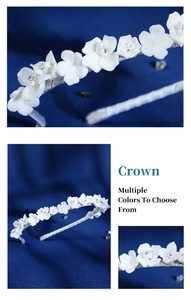Detailed macro view of handmade white ceramic flowers and rhinestones on a bridal headband
