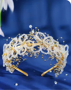 Detail of handcrafted bridal headband with yellow crystal beads on a gold metal frame