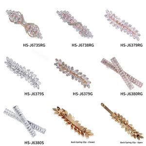 Detail of Korean bow zircon hair clip showing metal spring mechanism open and closed
