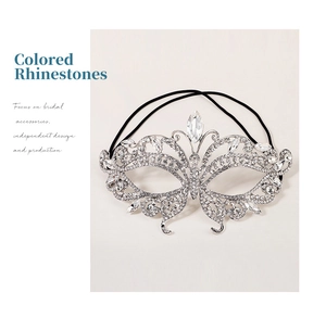 Macro detail of luxury butterfly rhinestone mask with silver base and sparkling crystals