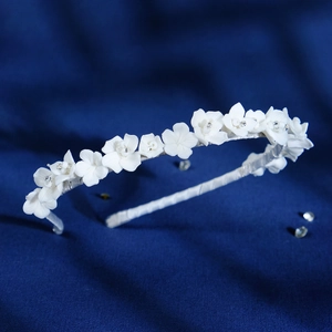 Elegant white ceramic flower headband with handmade pearls for bridal wedding hair styling