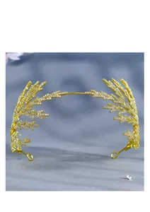 Detail showing luxurious golden bridal headband with intricate white rhinestone branch patterns