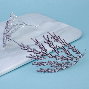 Detail of luxury bridal headband with branch design and deep purple rhinestones