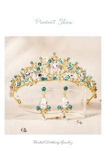 Detailed view of bridal jewelry set with golden crown and crystal earrings