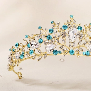 Luxurious gold crown set with blue teardrop crystals and sparkling rhinestones for brides
