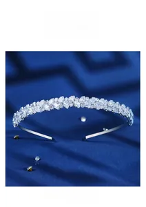 Detail of silver bridal headband featuring water-drop cubic zirconia on blue velvet