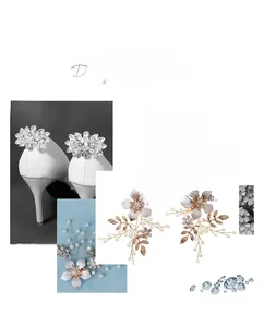 Detailed close-up of handmade bridal shoe clips featuring crystals and golden flower leaves