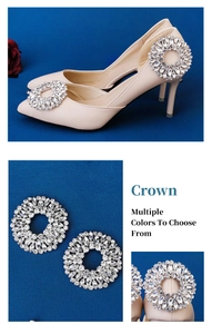 Detail showing the sparkling rhinestone crown ornament on beige high heel pointed shoes