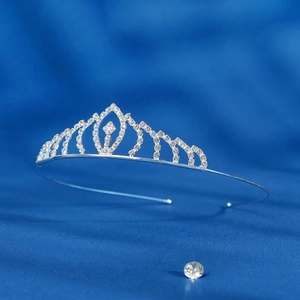 Close-up detail of silver alloy wedding tiara with sparkling crystal rhinestones