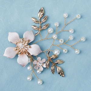 Handmade bridal shoe clips featuring delicate pink flowers and golden leaf detailing