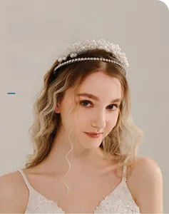 Close-up of elegant double-layer headband with white pearls and sparkling rhinestones
