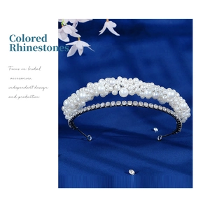 Detailed close-up of double-layer bridal headband with pearls and sparkling rhinestones