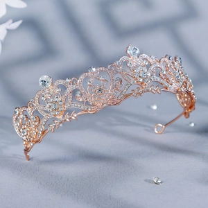 Elegant rose gold bridal crown with sparkling rhinestones and delicate hollow heart patterns