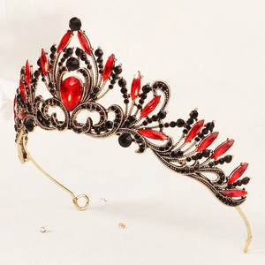 Close-up of vintage Baroque bridal crown featuring red waterdrop crystals and black rhinestones