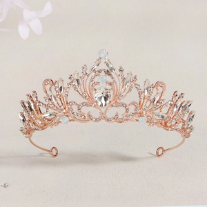 Luxurious rose gold crystal tiara with intricate floral hollow design and rhinestones